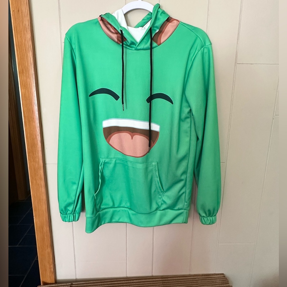 Green hoodie with some YouTuber or meme logo on it.